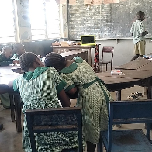 Learners working together in small groups during an interactive classroom lesson supported by eduLET Africa, promoting inclusive and technology-enabled education in a rural school.